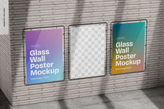Wall-mounted glass poster mockups in urban setting